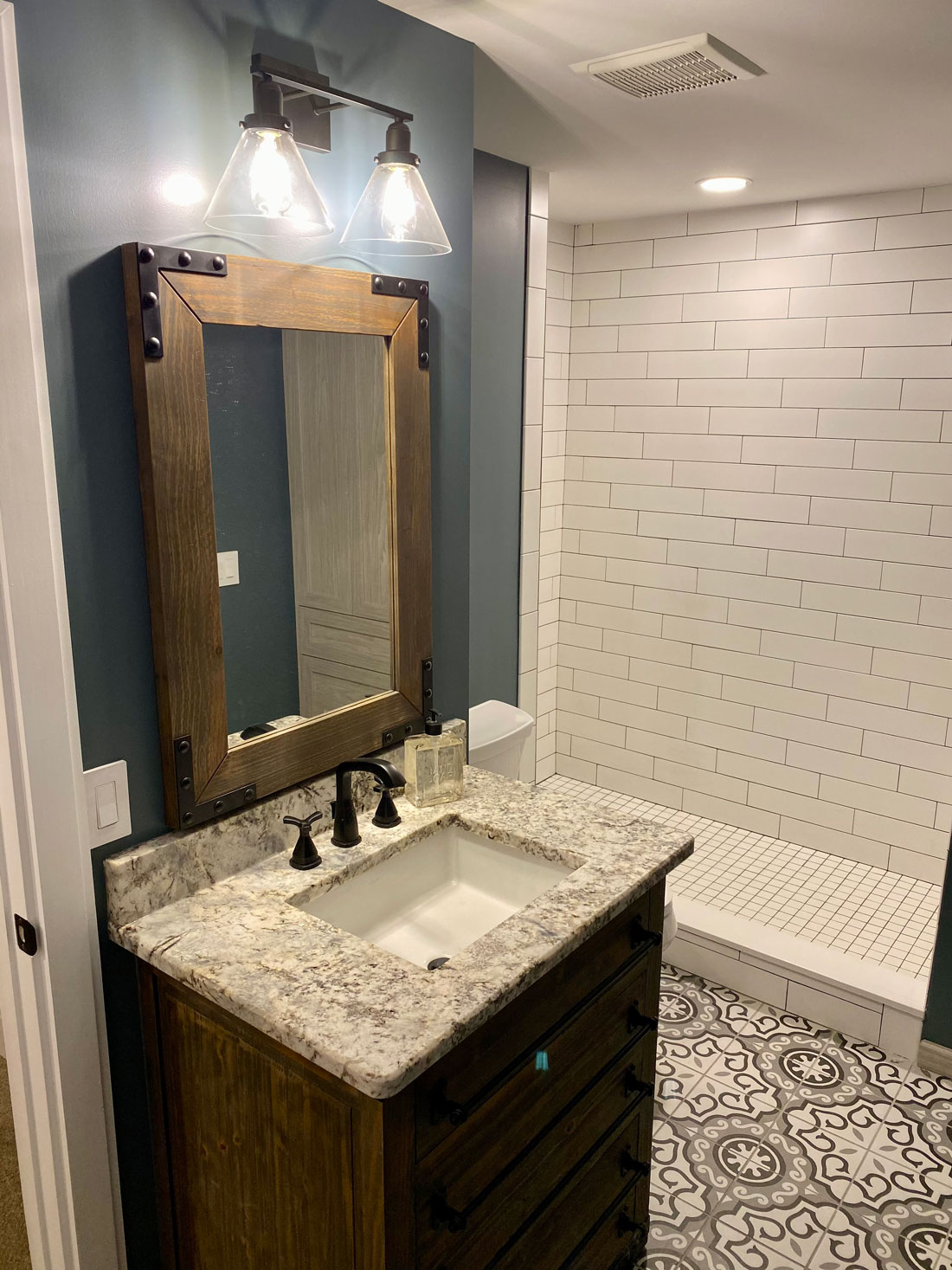 A basement bathroom with Cypress Wood accents